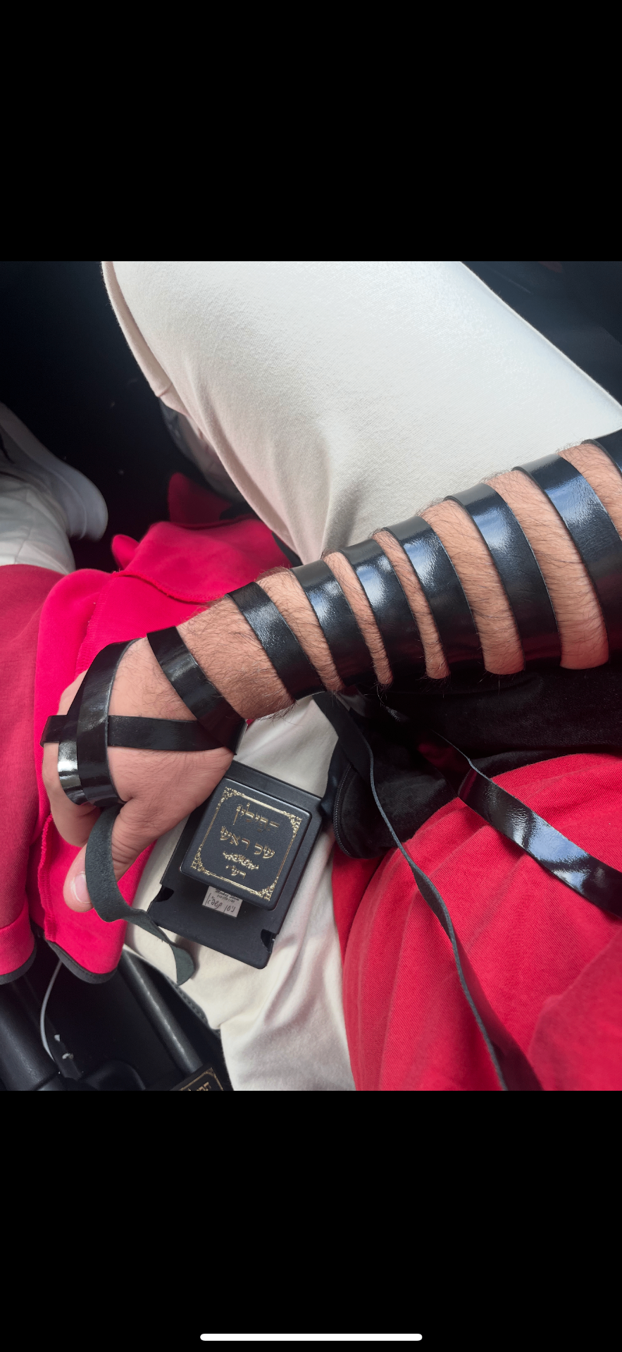 How Community Tefillin Practice Strengthens Jewish Identity