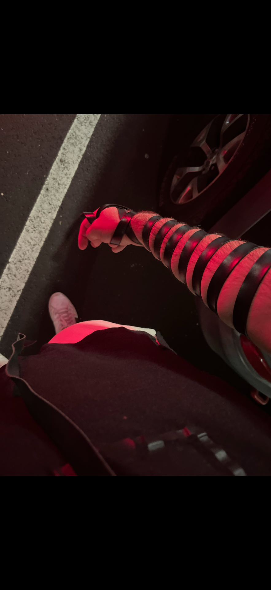 Person with tefillin in red lighting